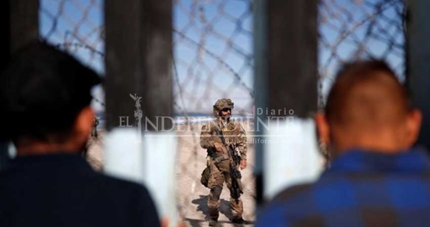 Migrantes topan con muro de Trump en Tijuana Migrantes topan con muro de Trump en Tijuana