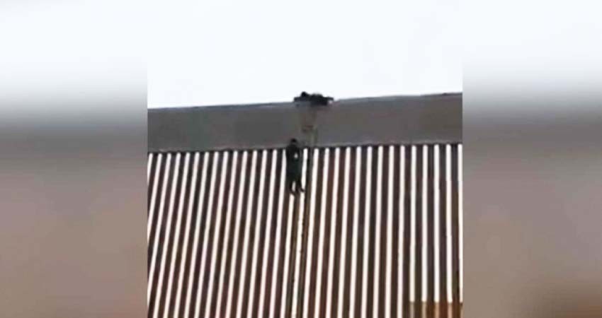 Migrante logra burlar muro fronterizo con escalera de cuerdas Migrante logra burlar muro fronterizo con escalera de cuerdas